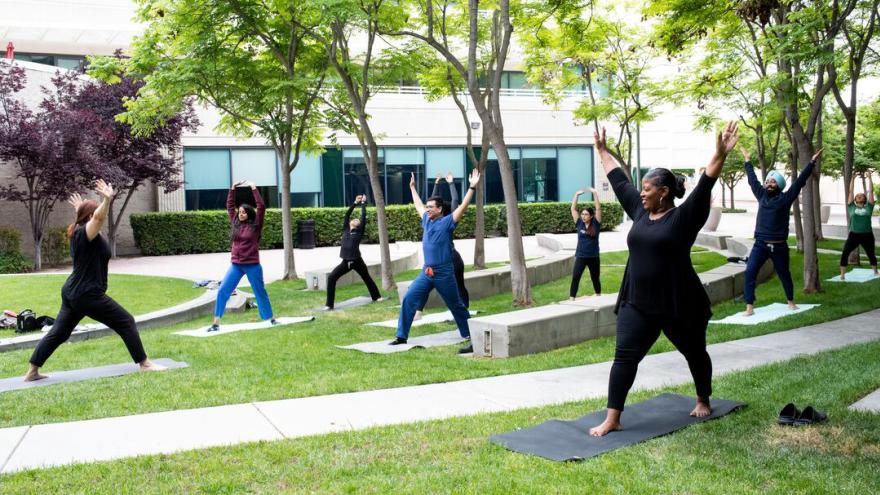 UCSF employees practice yoga outside