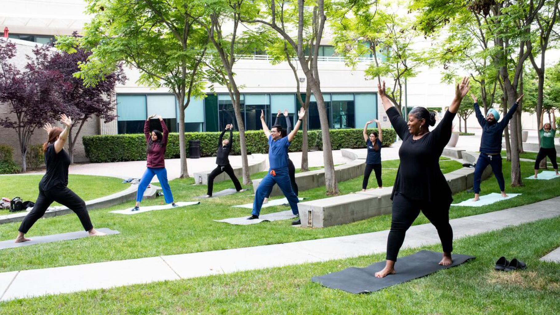 UCSF employees practice yoga outside