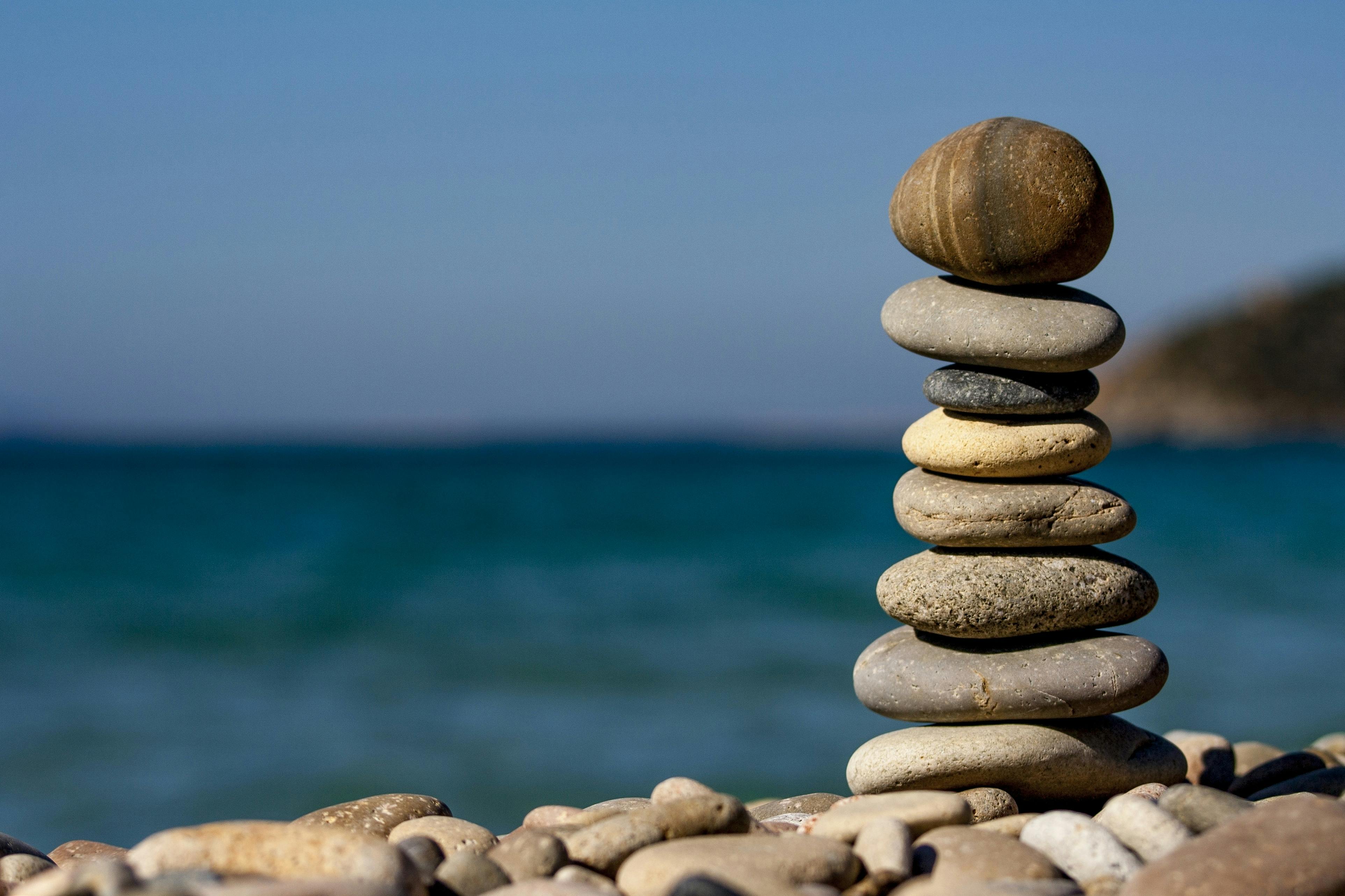 Pile of stones stacked at the beach