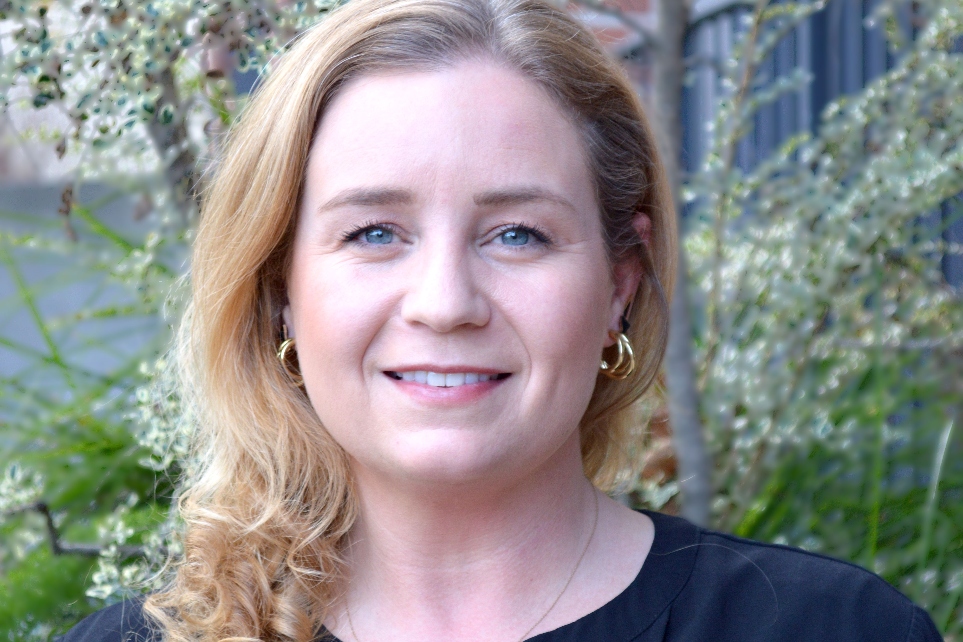 Jessica Allanson — woman with blonde hair in front of foliage