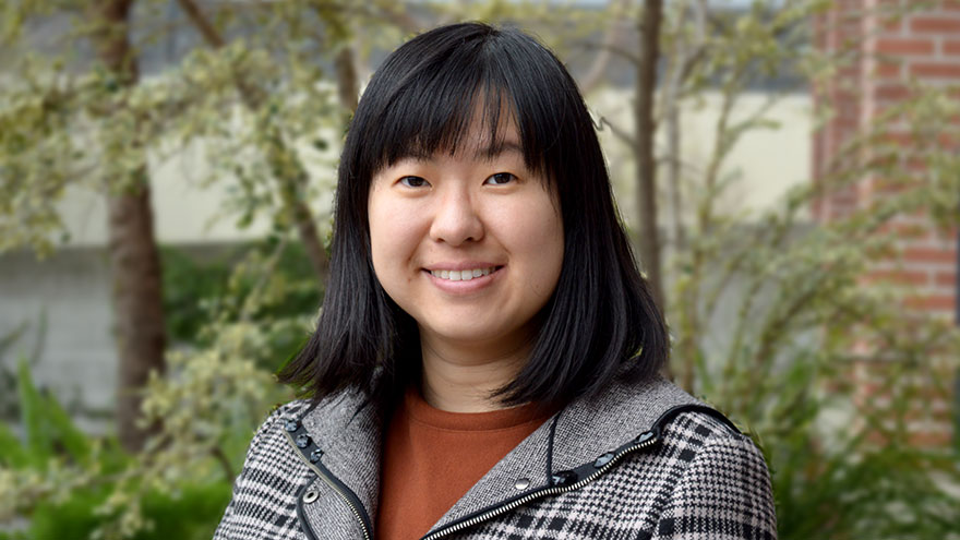 Tina Xinru Wang — Asian woman with black hair and patterned jacket