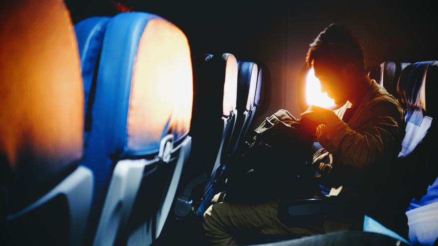 male passenger on airplane