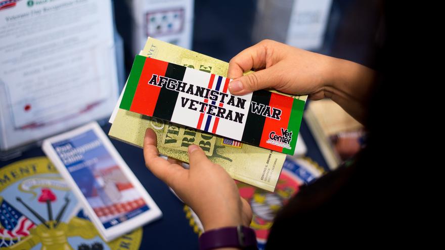 Person holds Afghanistan war veteran card