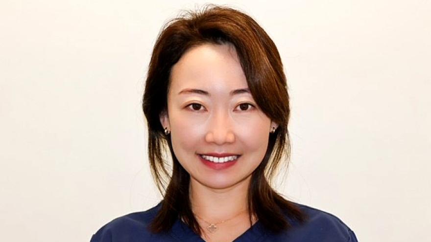 Bei Kong: Asian woman with dark hair and black sweater