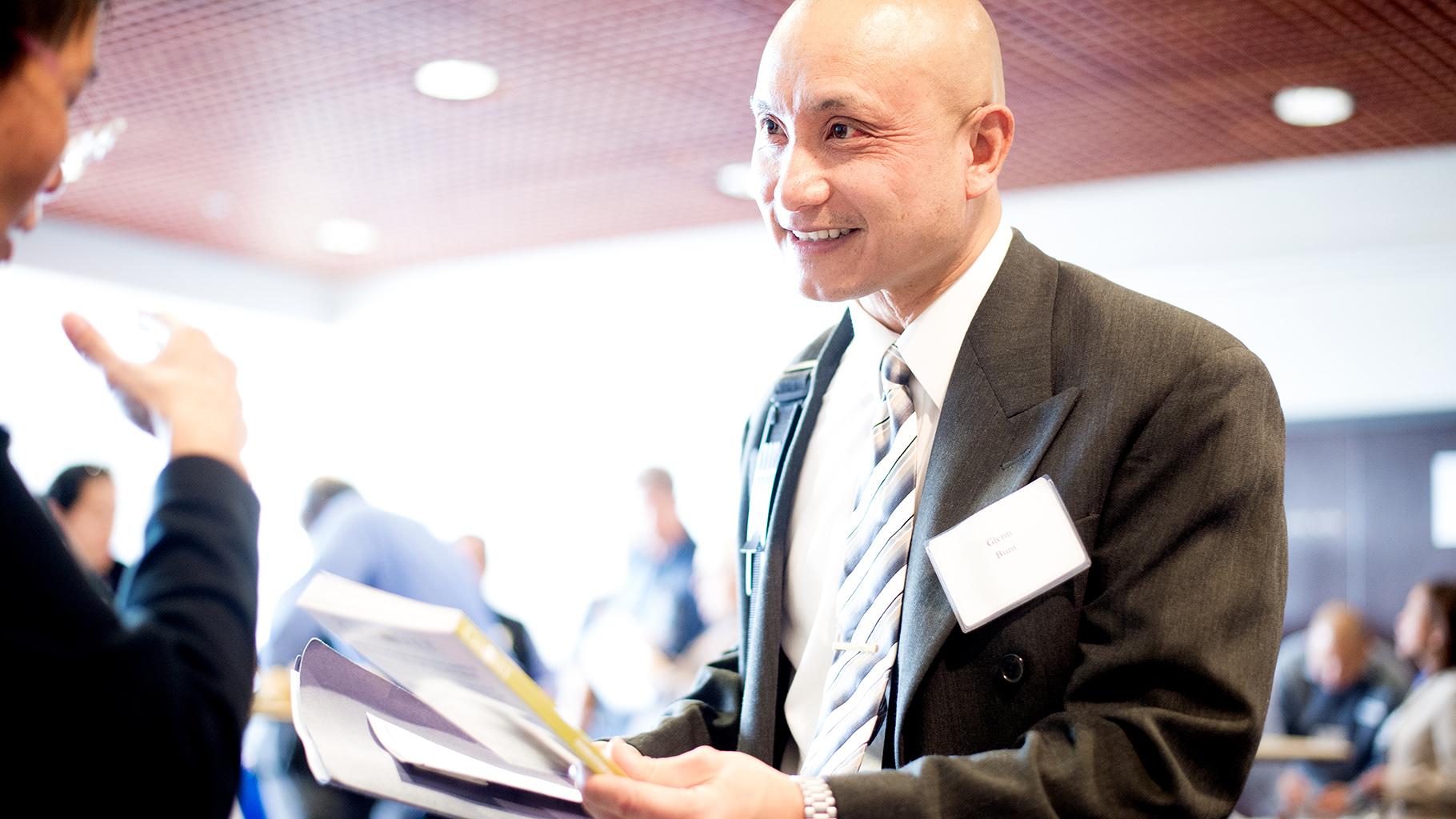 Veteran chats with manager at job fair