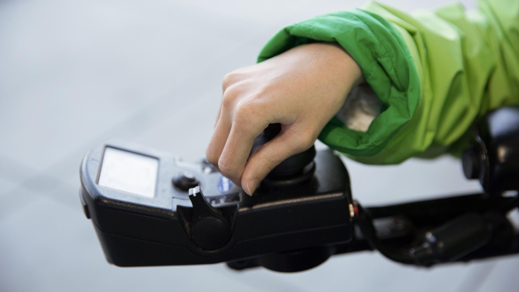 Hand controlling motorized scooter