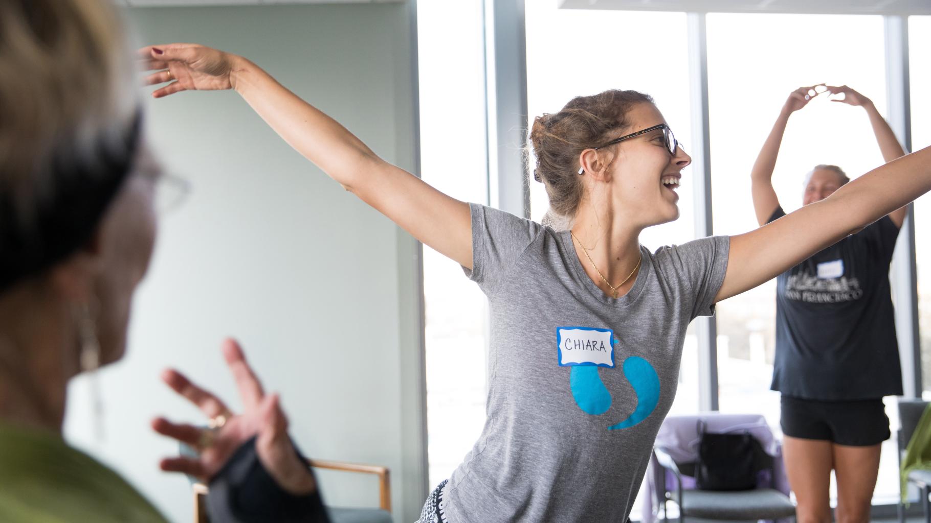 UCSF employee smiles while practicing yoga